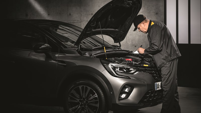 A man servicing Renault vehicle