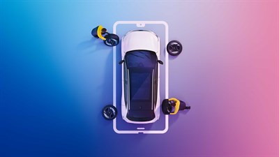 A women looking towards her Renault vehicle