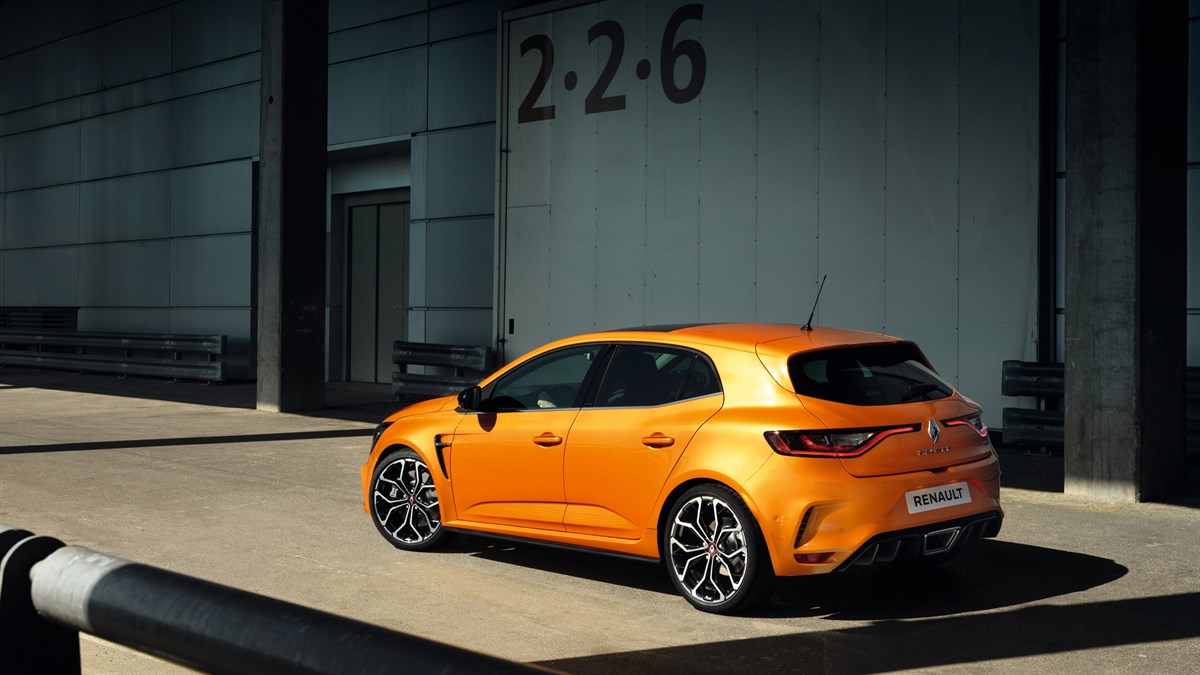 Orange-colored Renault Megane R.S. on the road