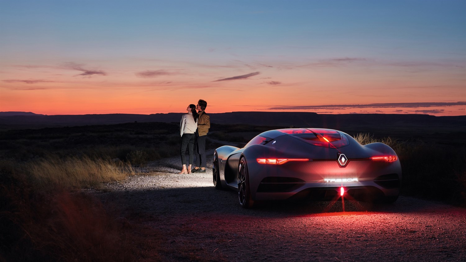 Couple Standing Ahead Of The Renault TREZOR Concept Car