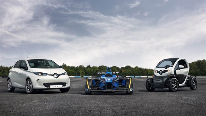A front view of three Renault Sport series cars parked on a race track