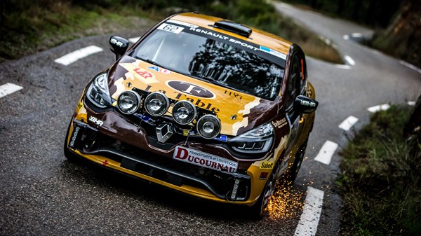 A front view of the Renault CLIO Sport car running on the track