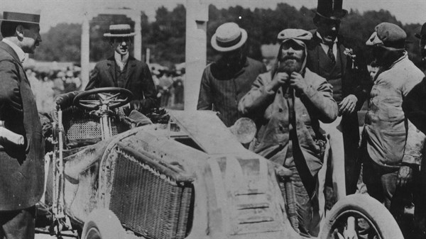 Black and white photo of people standing at the Renault race drive