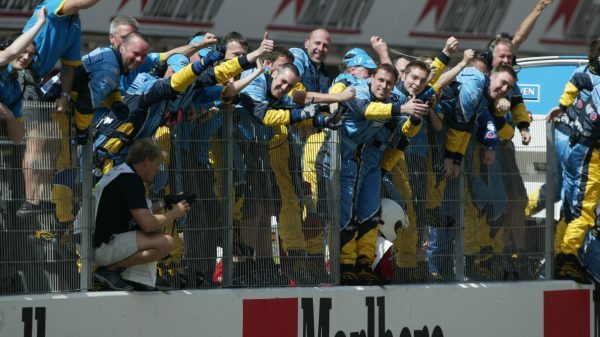 A group of Renault Sport racers cheering up on the grandstand