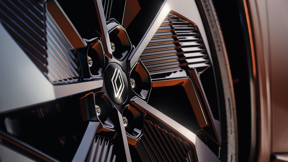 A front corner view of the wine-colored Renault KOLEOS running in the rocky hill