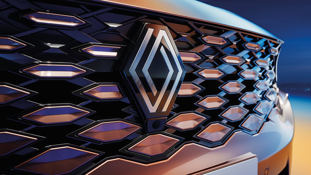 A back view of the wine-colored New Renault KOLEOS running in the city